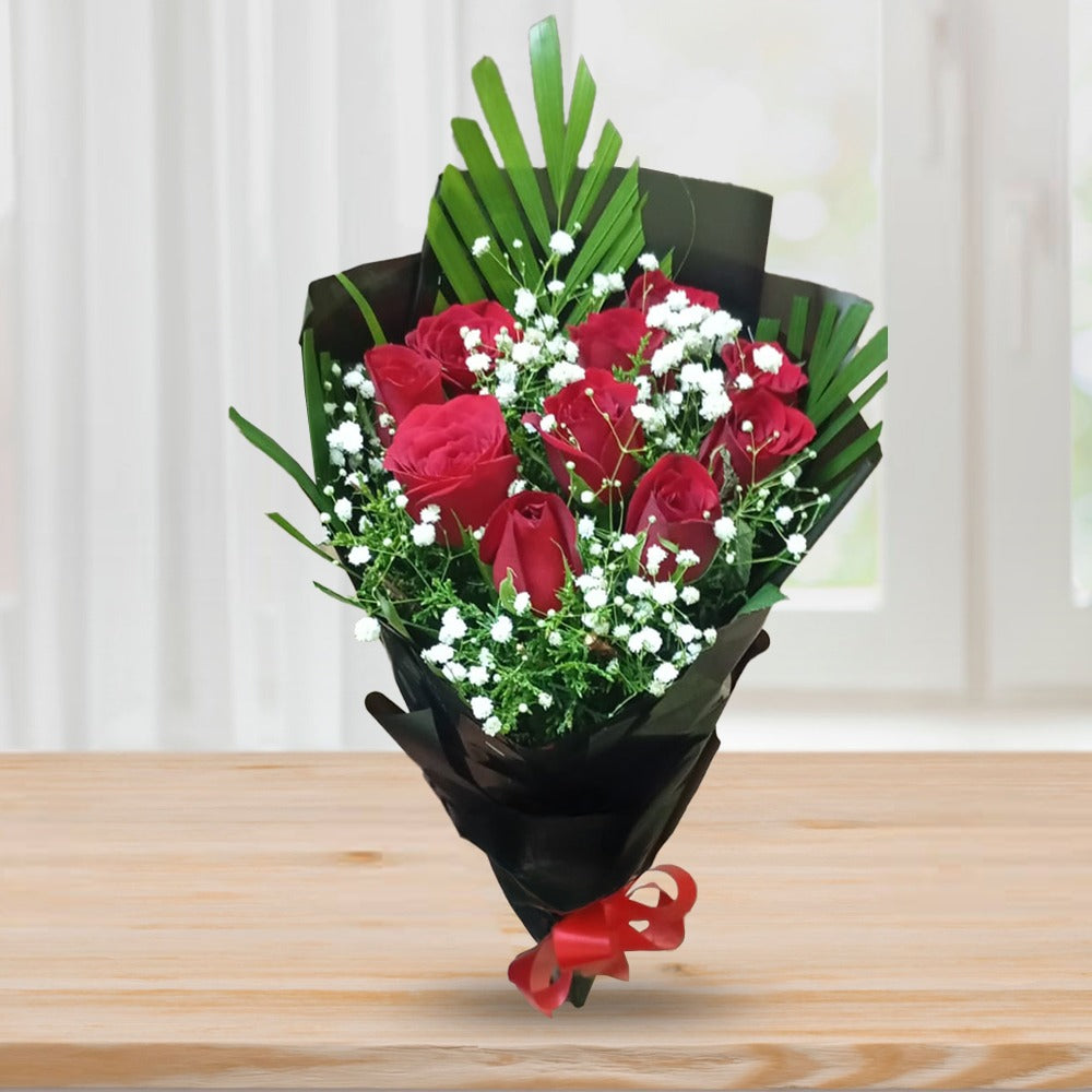 Red roses in black paper