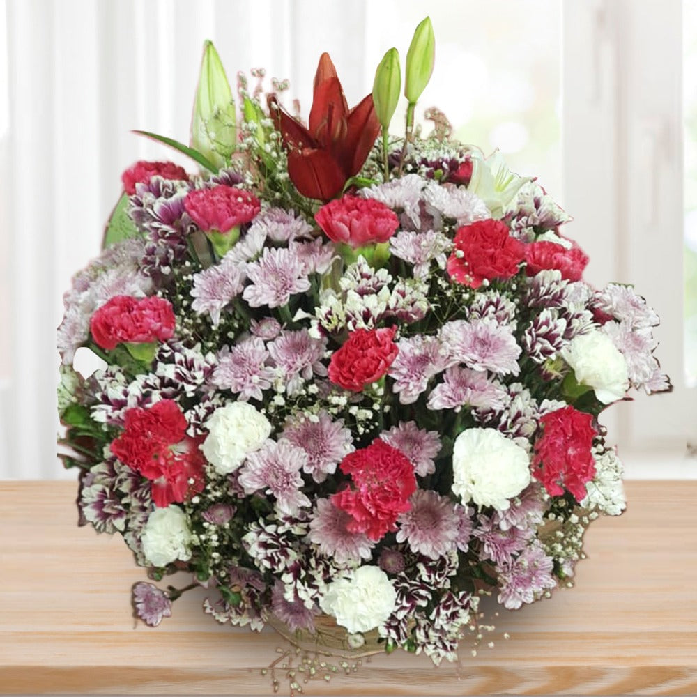 Chrysanthemums and Carnations and Lilies in a Basket